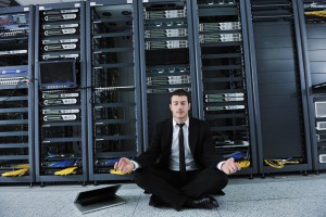 man meditating in data center