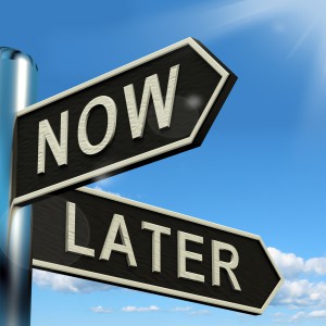 Now Or Later Signpost Shows Delay Deadlines And Urgency