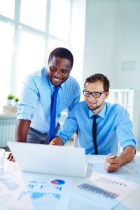 Two confident employees networking at meeting